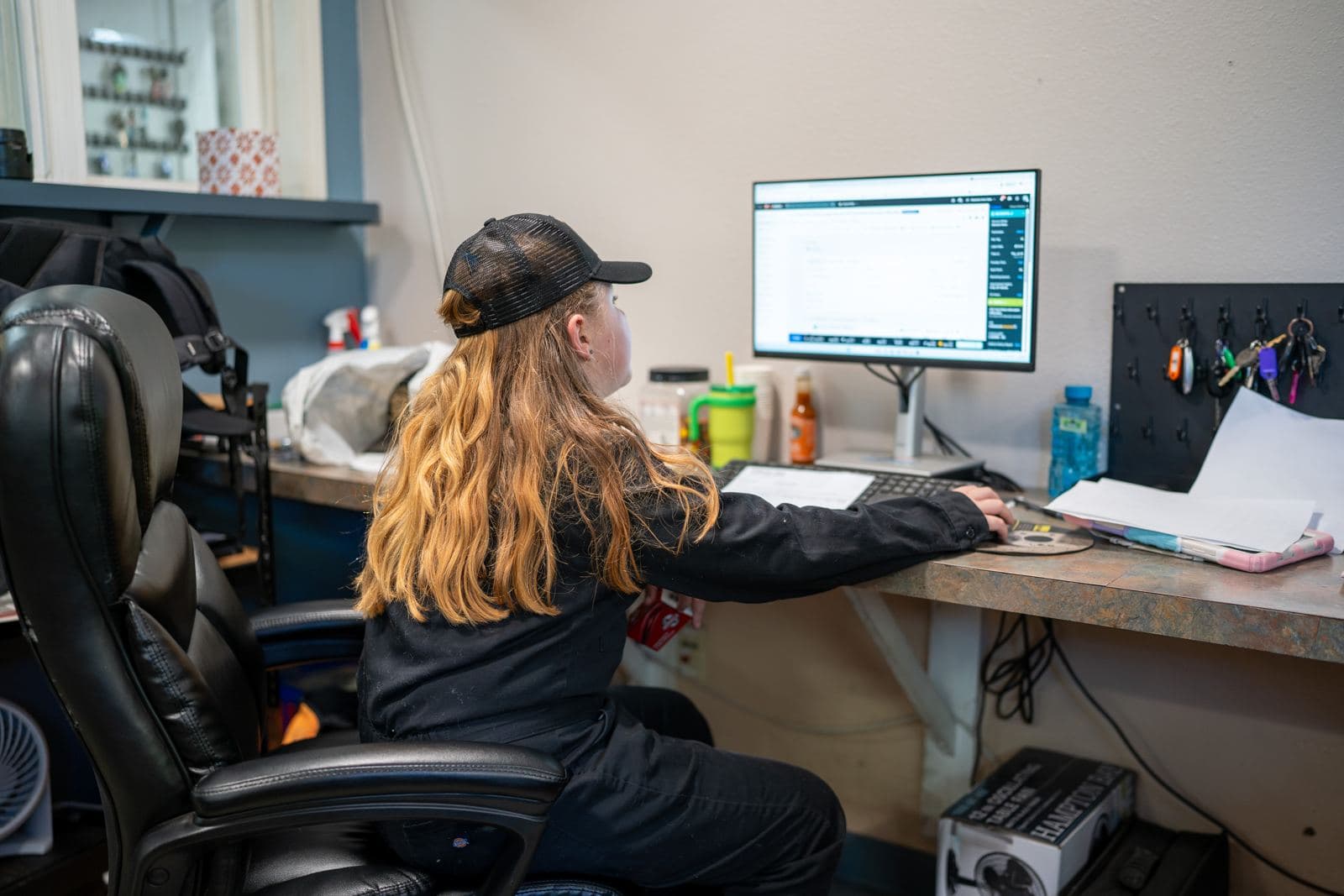 Service advisor working at the front desk computer