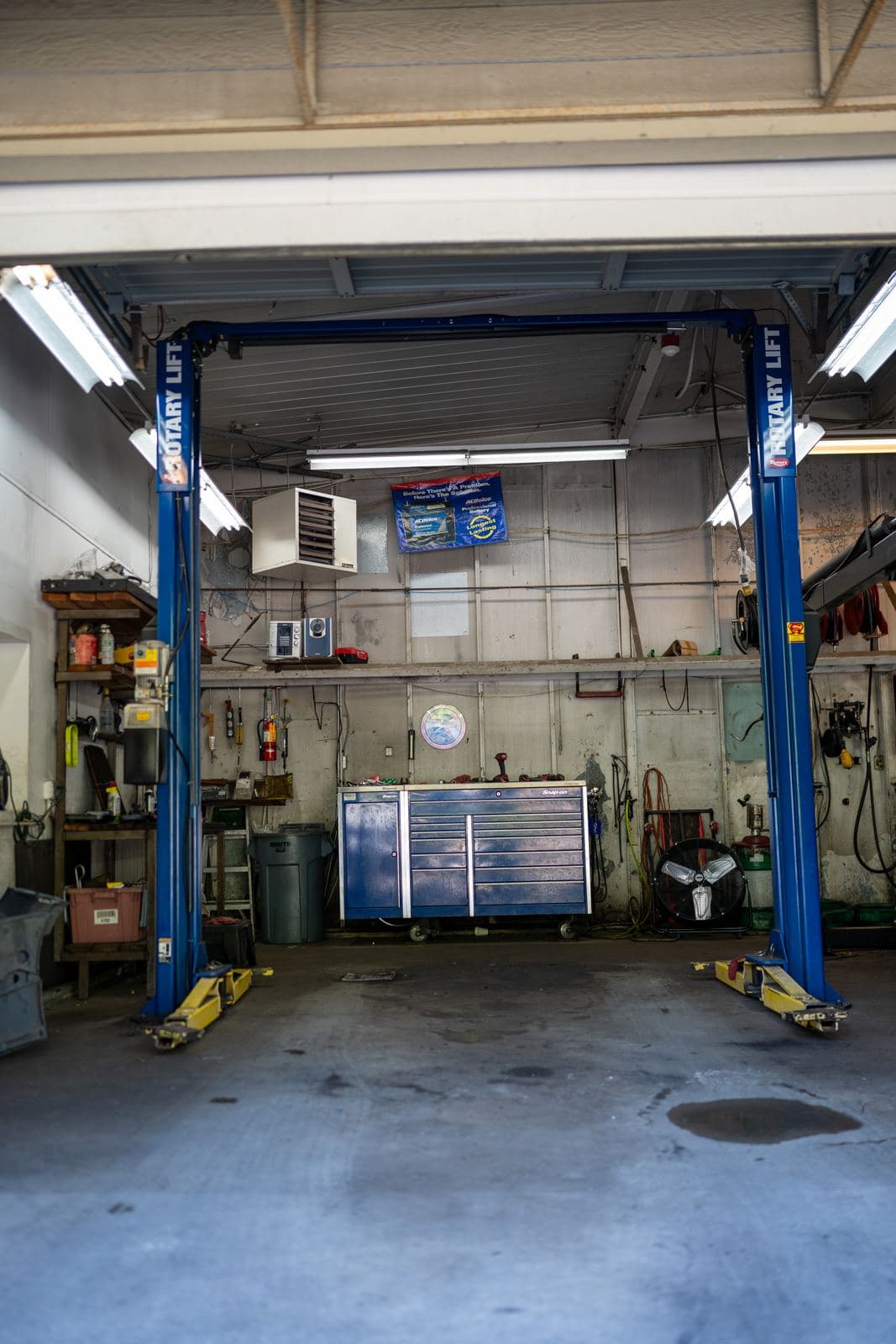 Empty service bay with a two-post lift