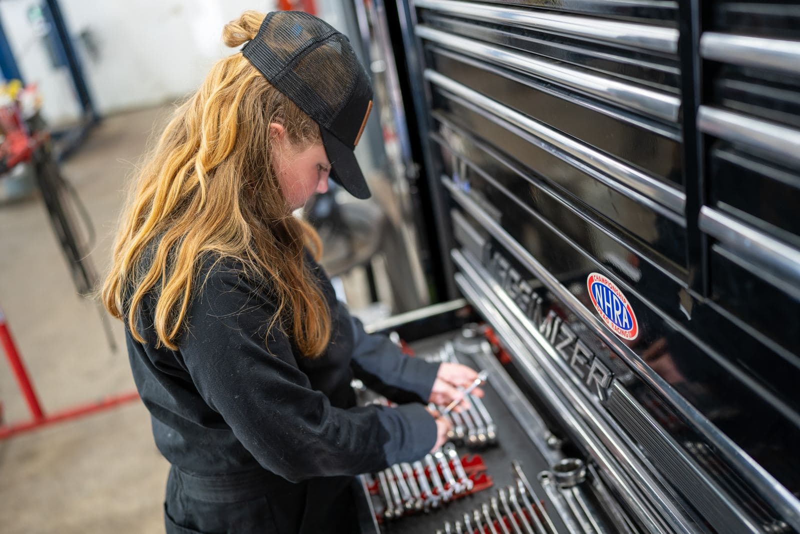 Technician selecting a wrench from the tool chest