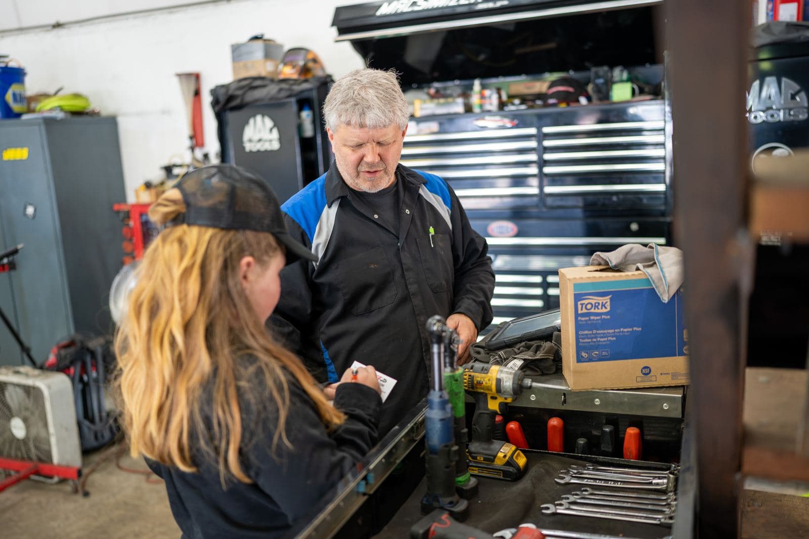 Technicians working together at the tool bench