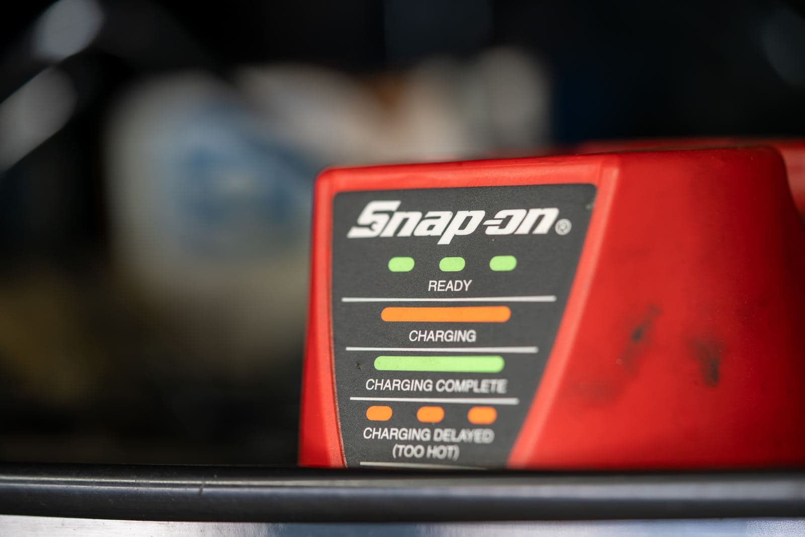 Snap-on battery charger status panel